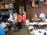 Various Legislators and anglers wait in the short lunch line