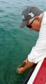 Senator Ken Horn releases a Lake St. Clair smallmouth bass