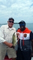 Senator Ken Horn with boater Tommy Robinson and a bass he caught