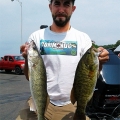 Zack Morrison with a walleye and smallmouth bass