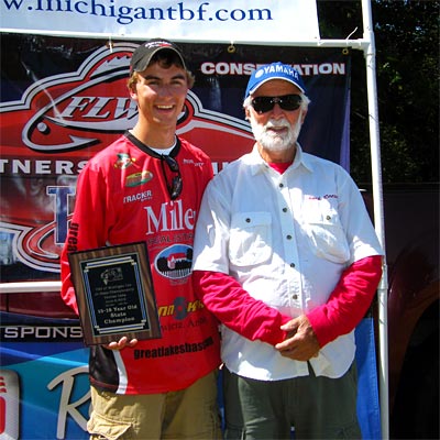 2012 older group winner Danny Sprague gets his picture taken with his volunteer boater for the day on Pontiac Lake, Chuck Reese