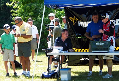 Star host of Hook n' Look Kim Stricker (yellow shirt) made an excellent emcee for the 2012 TBF of Michigan Jr State Championship while Youth Director Brian Belevender (standing, blue shirt) and past champion Cody Harris read off the kids' total catch weight