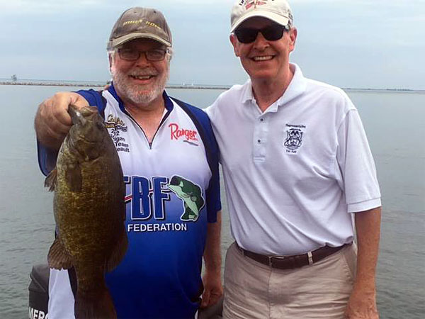TBF of Michigan President David Reault shows off a big Lake St. Clair smallmouth bass caught while fishing with Michigan State Representative Tim Kelly.